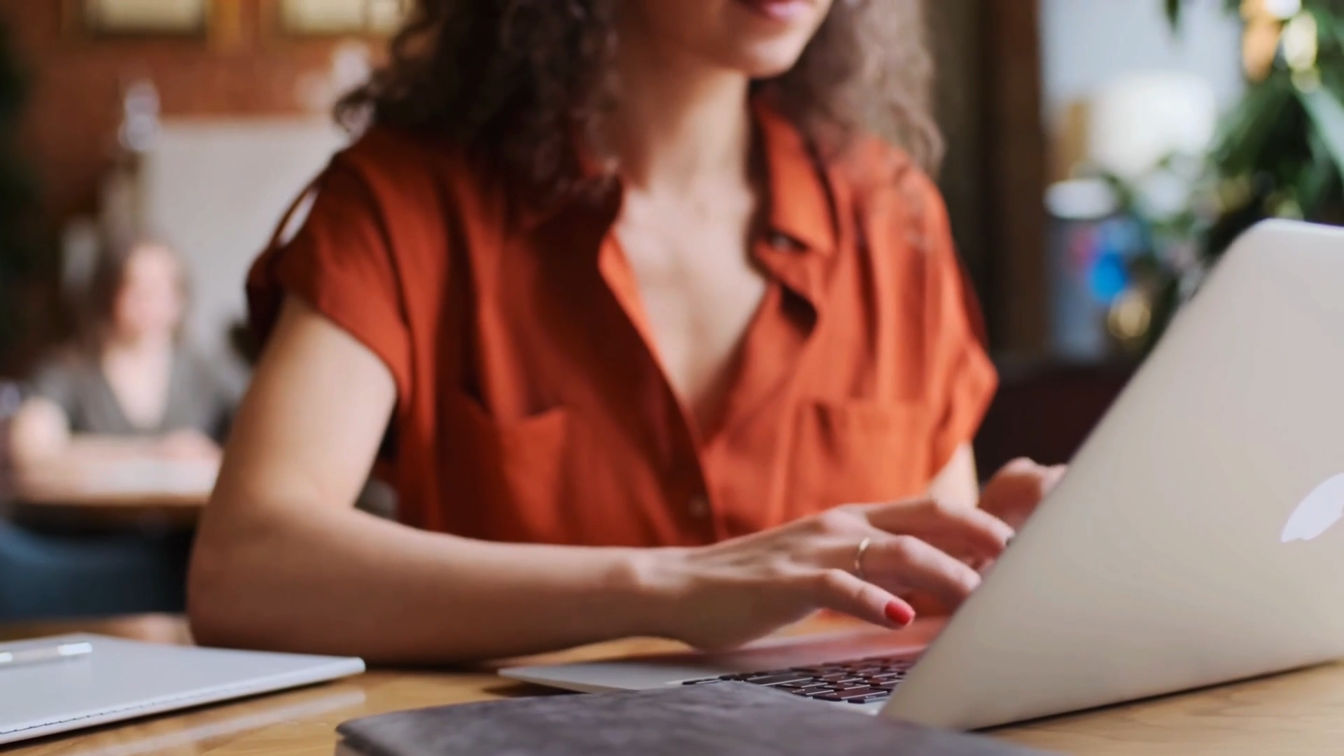 worker typing on a laptop